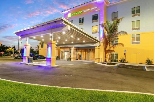 a hotel with a gas station in a parking lot at Holiday Inn Express and Suites - Nokomis - Sarasota South in Nokomis
