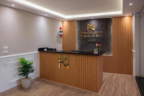 a lobby with a reception desk in a building at Museum And Nile View Hotel in Cairo