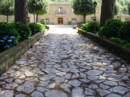 a cobblestone street in front of a building at Tenuta Montelaura in Forino