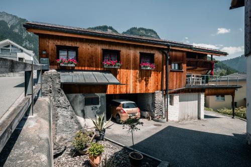 a house with a car parked in front of it at Casa Marie in Malans