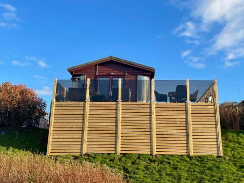 a house on a hill with a gazebo at Ribble Valley Lodge Retreat in Gisburn