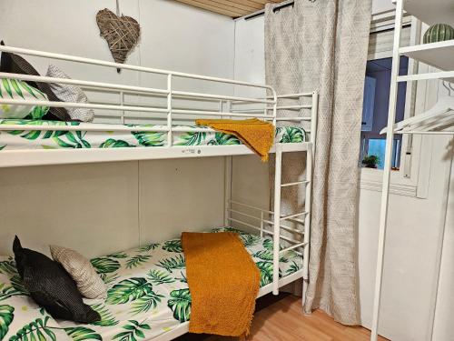 a room with two bunk beds in a room at La Manga Beach House in La Manga del Mar Menor