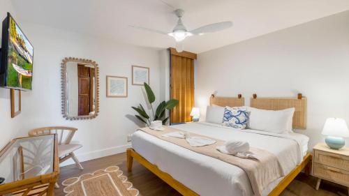 En eller flere senge i et værelse på Perch - Maui 307