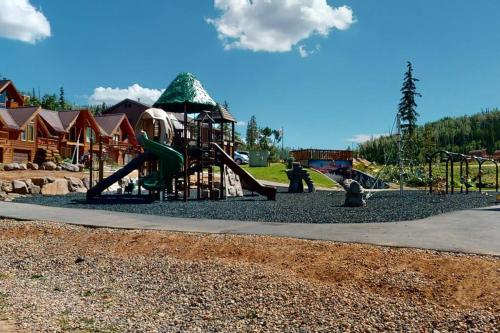 a park with a playground with a slide at Platinum Studio Pool-Spa Ski-in out Gym, Sauna, Laundry, BBQ in Brian Head