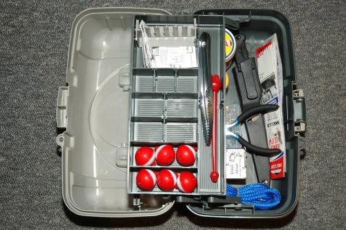 a suitcase filled with red balls and other items at Platinum Studio Pool-Spa Ski-in out Gym, Sauna, Laundry, BBQ in Brian Head