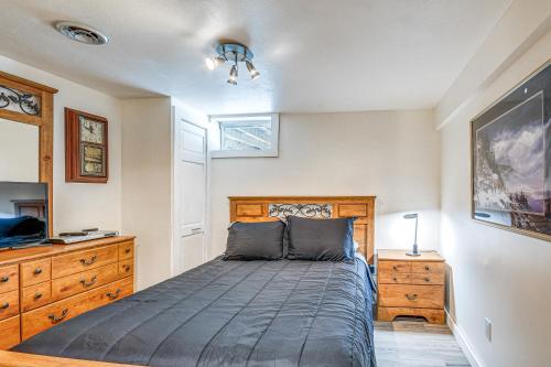 a bedroom with a bed and a dresser and a television at Picturesque Phoenix Vacation Home on Oswego River! in Phoenix