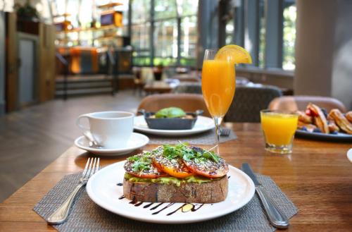 a table with a plate of food on a table at Crowne Plaza Atlanta Perimeter at Ravinia by IHG in Atlanta