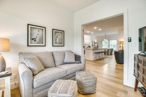 a living room with a couch and a table at Flippin Vacation Rental Walk to White River! in Flippin
