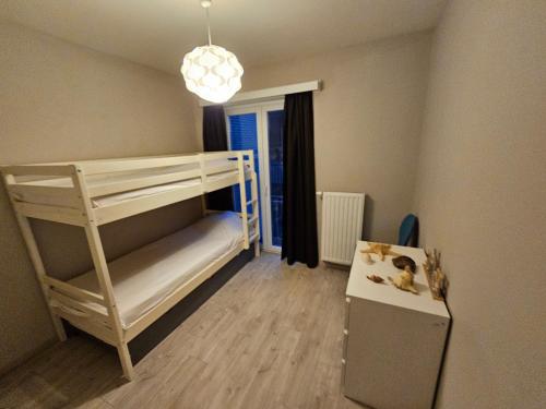 Postel nebo postele na pokoji v ubytování Côte à l'Oostduinkerke met gratis garage