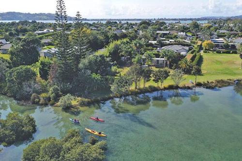 a group of people in kayaks on a river at Point Wells Casita in Omaha