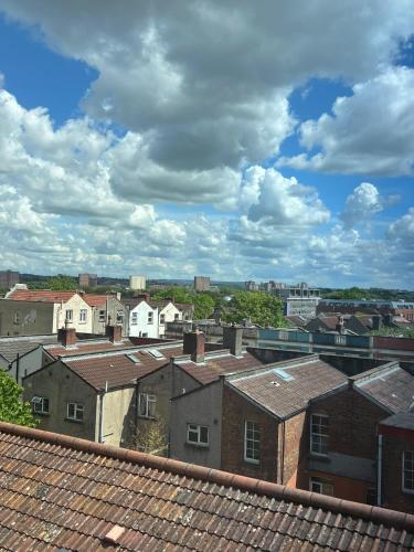 a view of a city with buildings and roofs at Stokes Croft - Whole Apartment - City Centre - Serviced Accommodation BS1 in Bristol