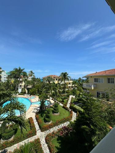 an aerial view of a resort with a swimming pool at Las Palmeras by Graziano in Boca Chica