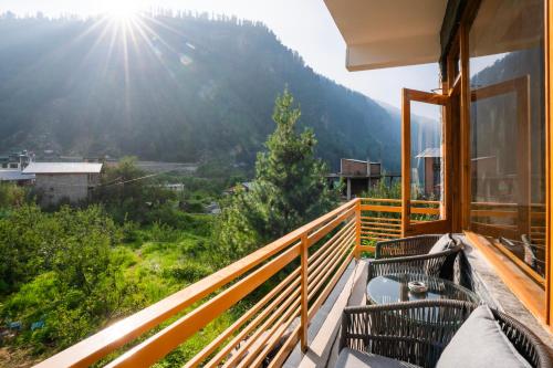 a balcony with a view of a mountain at Olgah Manali in Manāli