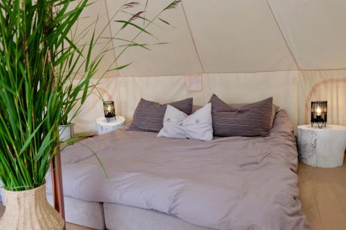 Postel nebo postele na pokoji v ubytování Mändjala Glamping
