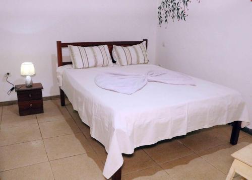 Ένα ή περισσότερα κρεβάτια σε δωμάτιο στο Mandinga Guest house