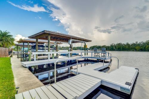 a boat dock with a gazebo on the water at Riverfront Homosassa Retreat with Kayak and Boat Dock! in Homosassa