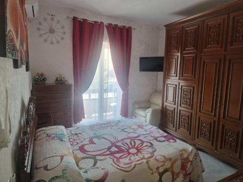 Ένα ή περισσότερα κρεβάτια σε δωμάτιο στο Serenella House