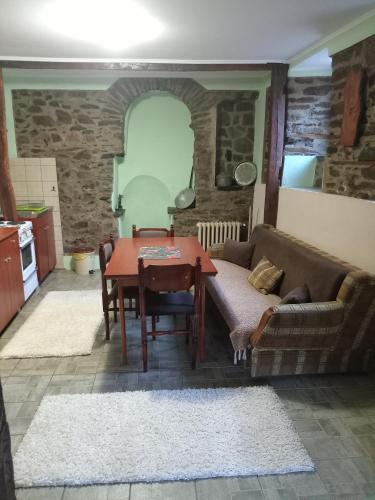 a living room with a couch and a table at **ETNO Vila** - KRUSEVO in Kruševo