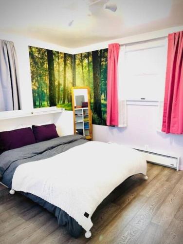 a bedroom with a large bed and a window at Catskill Cabin, Cool Apartment, 2nd Floor in Shandaken