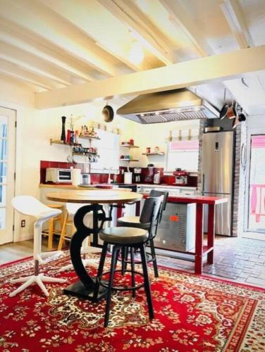 a kitchen with a table and chairs in a room at Catskill Cabin, Cool Apartment, 2nd Floor in Shandaken