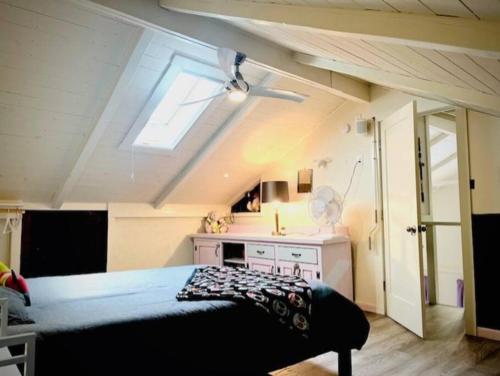 a bedroom with a bed with a sink and a window at Catskill Cabin, Cool Apartment, 2nd Floor in Shandaken