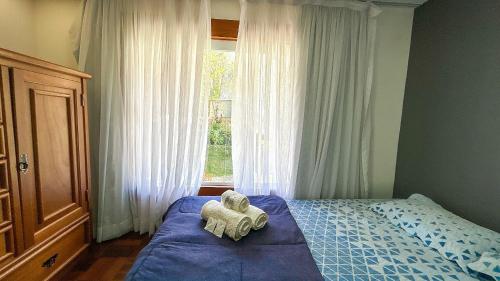 Voodi või voodid majutusasutuse Casa na serra com piscina toas