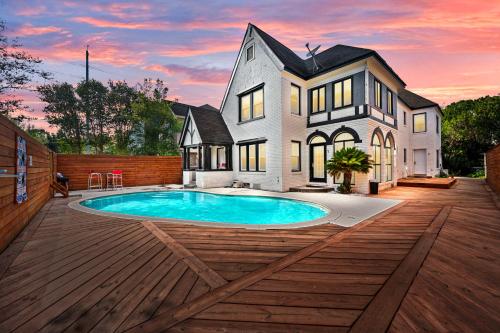 a house with a swimming pool on a wooden deck at Modern & Spacious 3BR Retreat on Prime Location in Houston