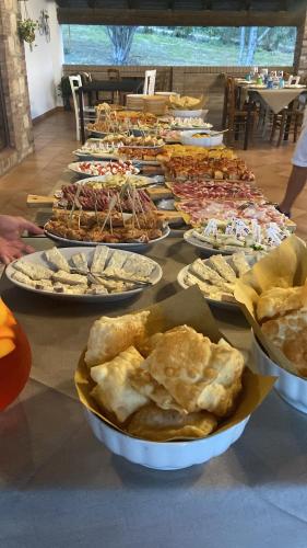 a table with a bunch of plates of food at Agriturismo cergallina in Vernasca