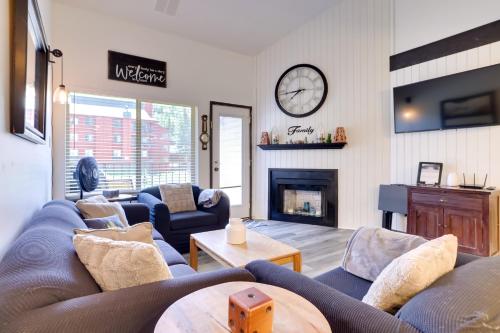 a living room with a couch and a fireplace at Ski-InandOut Condo with Hot Tub Access in Brian Head! in Brian Head