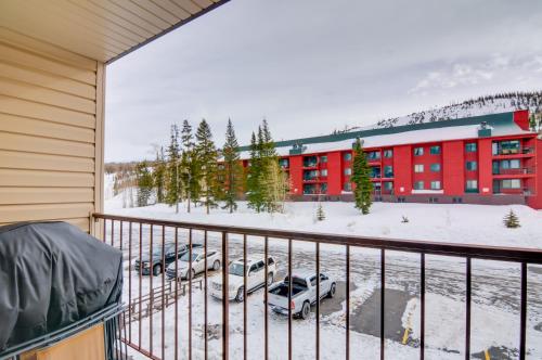 a balcony view of a building with cars parked in the snow at Ski-InandOut Condo with Hot Tub Access in Brian Head! in Brian Head