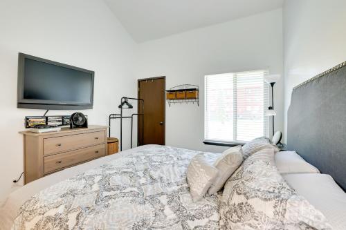 a bedroom with a bed and a flat screen tv at Ski-InandOut Condo with Hot Tub Access in Brian Head! in Brian Head