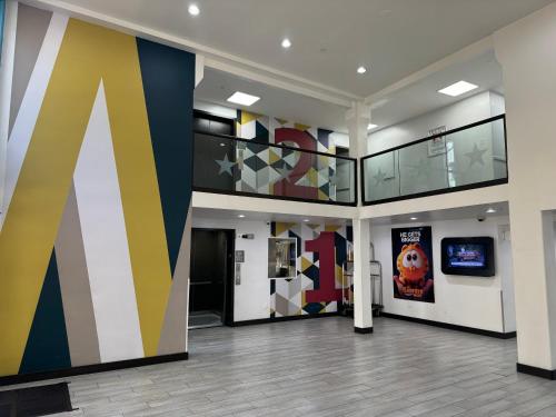 a lobby with a large letter k on the wall at Motel 6 Hollywood in Los Angeles