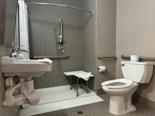 a bathroom with a toilet and a sink and a shower at Motel 6 Hollywood in Los Angeles