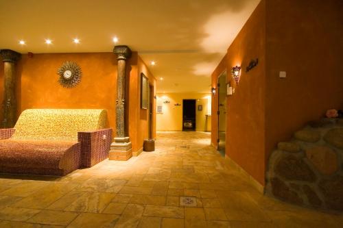 a hallway of a hotel with a bed in a room at Grand Rose SPA Hotel in Kuressaare