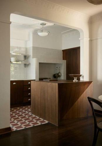 a kitchen with a wooden counter in a room at Art Deco Boutique Bespoke Brilliance & Beach&Park in Melbourne