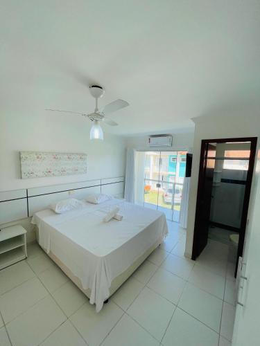 Postel nebo postele na pokoji v ubytování Apartamento 10 - Praia Taperapuã- BA- Próximo ao Axé Moi -até 8 pessoas