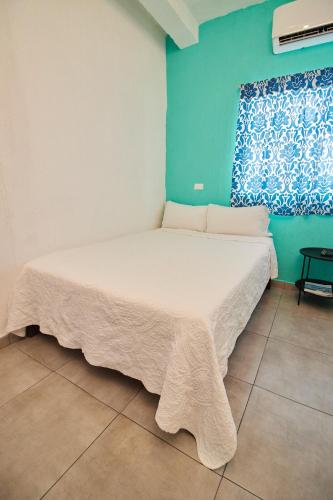 Ένα ή περισσότερα κρεβάτια σε δωμάτιο στο Hotel Casa Ceci Inn