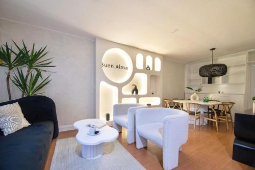a living room with a couch and chairs and a table at ¡Buen Alma! House in heart of Condesa 8 guests in Mexico City