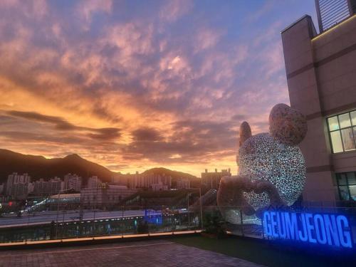 a teddy bear statue sitting on top of a building at House 1 min from Geumjeong St in Gunpo