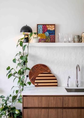 a kitchen with a sink and a counter with a bowl at The Artist Retreat 2BR Home 4mins from MCG in Melbourne