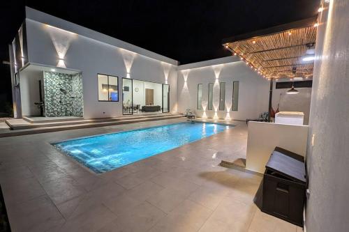 a swimming pool in the middle of a house at The Refuge Your Oasis in Nilo in Nilo