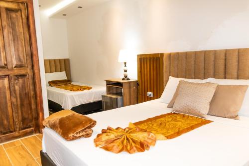 Voodi või voodid majutusasutuse Hotel Recuerdos de mi tierra toas