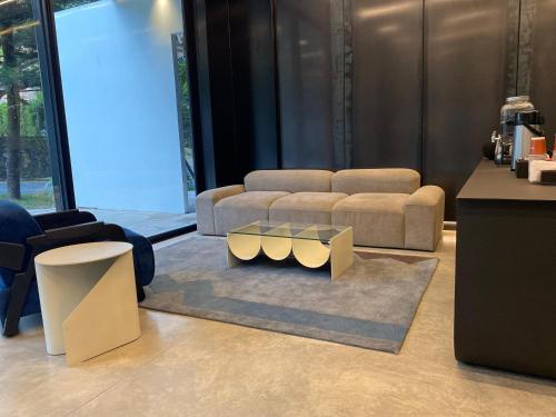 a living room with two couches and a coffee table at Nock - Reserved Residences in Medellín