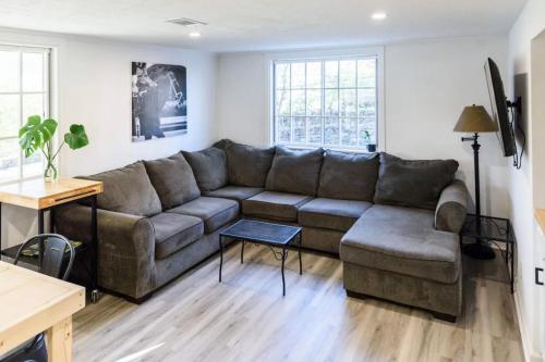 a living room with a couch and a table at Spacious 2-BR Retreat Near Louisville Attractions in Louisville