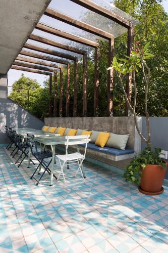 a patio with a table and chairs on a patio at La Campechana in the heart of Roma and Condesa in Mexico City