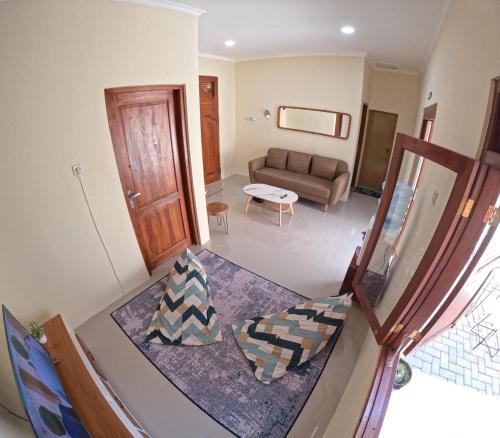 an overhead view of a living room with a couch at Joglo Prambanan Syariah in Bugisan