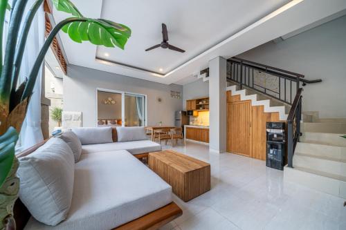 En eller flere senge i et værelse på Q LA Villas