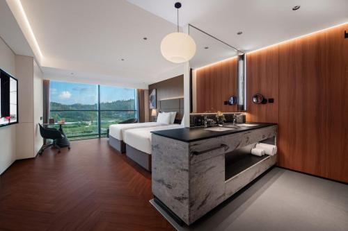 Postel nebo postele na pokoji v ubytování Intercity Hotel Shantou CHJ