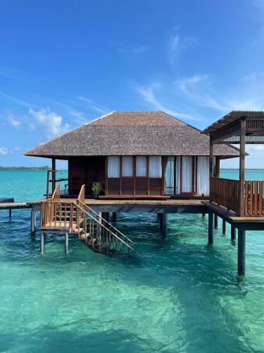 a house on a pier in the water at Leebong Island Resort in Leebong