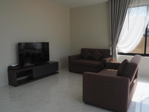 Ruang duduk di Baan First Pool Villa